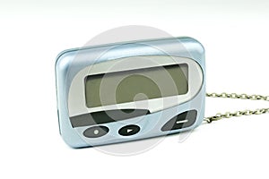 Close-up front old a cyan metallic pager or beeper on white floor and isolated with clipping path on white background.