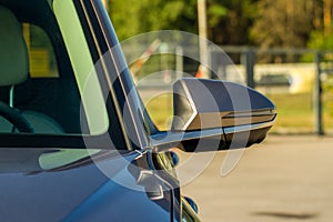 Close up front view of car side mirror.