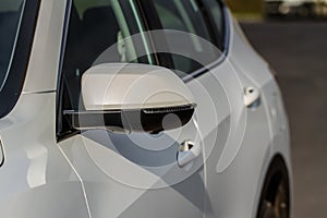 Close up front view of car side mirror.