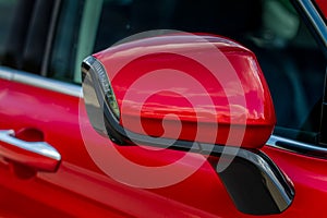 Close up front view of car side mirror. Front rear view mirror on the car window.