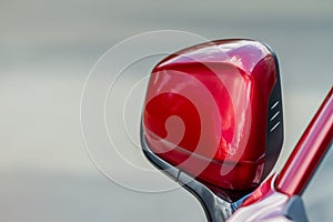 Close up front view of car side mirror. Front rear view mirror on the car window.