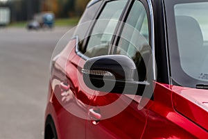 Close up front view of car side mirror. Front rear view mirror on the car window.