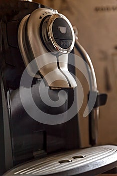 close up front view of modern automatic espresso coffee machine.