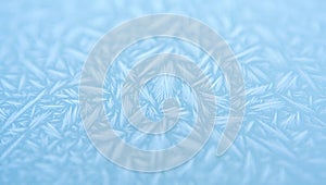 Close up of frost crystals on a pale blue background pattern texture