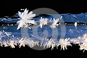 Close up at frozen ice crystals on a ice a cold sunny winter