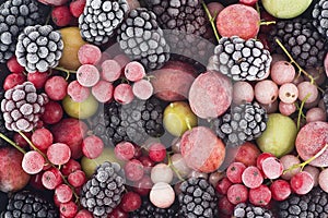 Close up of frozen mixed berries - red currant, white currant, blackberry, gooseberry and black currant