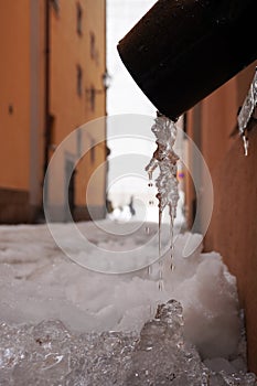 close-up of frozen water in a downpipe