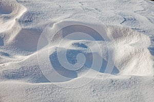 Close up of frozen white snow. Winter background. Snowy texture.