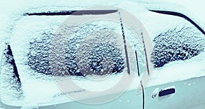 Close up frozen winter car covered snow, view side window on snowy background