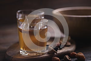 Close up of fruit compote in glass cups on wooden background