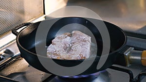 Close up of frying steak