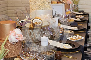 Close up of a fully set banquet table with brown and earth tones
