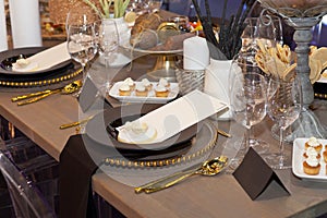 Close up of a fully set banquet table with brown and earth tones