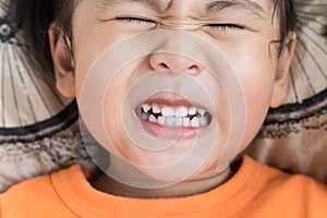 Close up funny face of children toothy acting