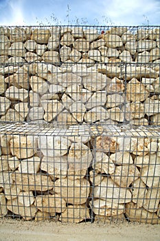 Close-up of a gabion retaining wall with wire mesh reinforcement