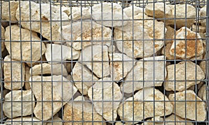 Close-up of a gabion retaining wall with wire mesh reinforcement