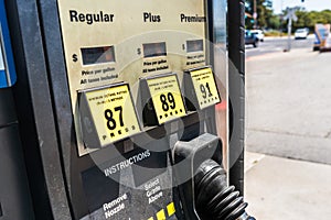 Close up of gas station pump; three octane grades available for selection; California, United States