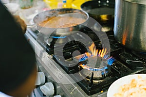 close up gas stove with blue flames