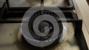 Close up gas torch or on a gas stove with blue flame ready to heat and cook. Burner gas stove working. Crisis and supply