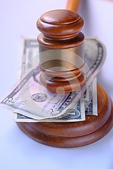 Close up of gavel and cash on table, law and order concept