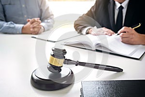 Close up of gavel, Male lawyer or judge Consult with client and