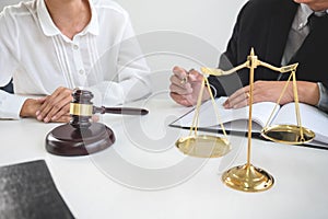 Close up of gavel, Male lawyer or judge Consult with client and