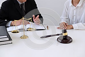 Close up of gavel, Male lawyer or judge Consult with client and