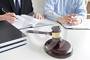 Close up of gavel, Male lawyer or judge Consult with client and