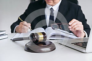 Close up of gavel, Male lawyer or judge working with Law books,