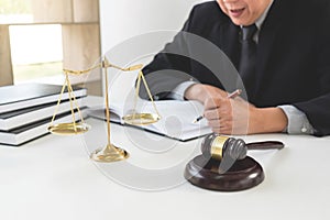 Close up of gavel, Male lawyer or judge working with Law books,