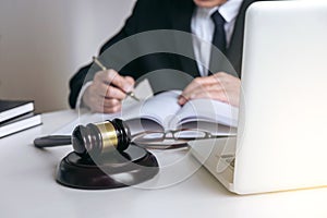 Close up of gavel, Male lawyer or judge working with Law books,