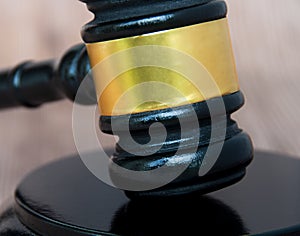 Close up of gavel on wooden table. Copy space and law concept