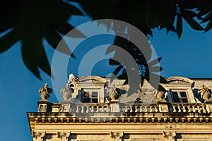 Close up of Gemini houses - casas gemelas - framed by leaves at the colonial city of Merida, Yucatan, Mexico