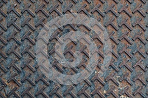 Close up geometric pattern of a metal manhole cover