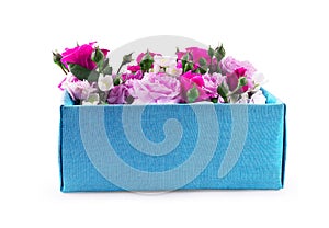 Close Up of gift box with flowers on a white background