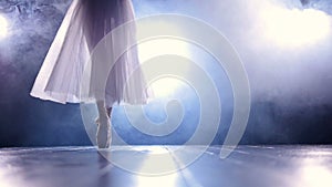 Close up of the girl dancing in the fog in pointe shoes. No face. Slow motion. HD.