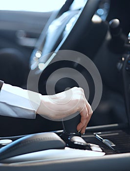 A close up of a girl driving a car