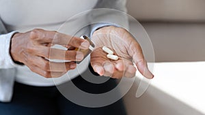 Close up of girl hold pills and jar in her hands
