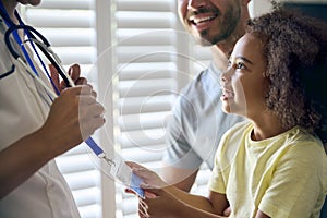 Close Up Of Girl Looking At Nurse's Security Lanyard 