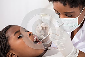 African Girl With Mouth Open During Oral Checkup photo