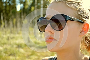 Close up girl portrait with footpath reflection on sunglasses
