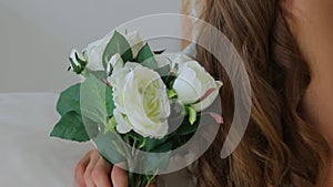 Close-up of a girl`s face, a congress on flowers