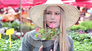 Close up of a girl smelling flowers