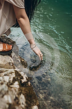 Close-up of a girl touching water