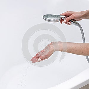 close-up girl washing and cleaning the sink in the bathroom