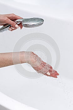 close-up girl washing and cleaning the sink in the bathroom