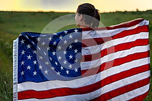 Close-up of a girl wrapped in the flag of america