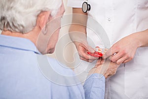 Close-up of giving medicine