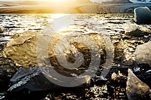 Close up of glacier ice in a lake in Iceland during sunset