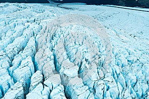 Close up glacier surface cracks view from plane